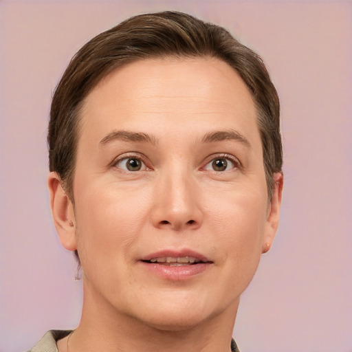 Joyful white young-adult female with short  brown hair and grey eyes