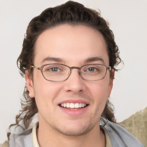 Joyful white young-adult male with medium  brown hair and brown eyes