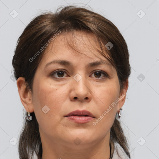 Joyful white adult female with medium  brown hair and grey eyes