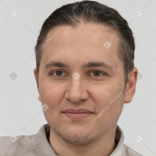 Joyful white adult male with short  brown hair and brown eyes