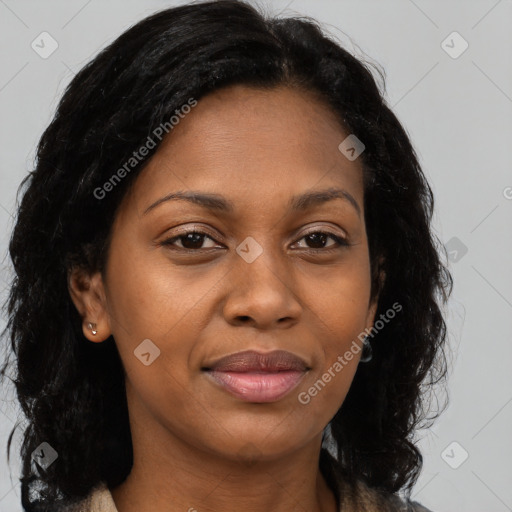 Joyful black young-adult female with long  brown hair and brown eyes