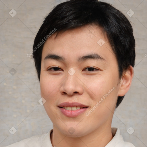 Joyful asian young-adult male with short  brown hair and brown eyes