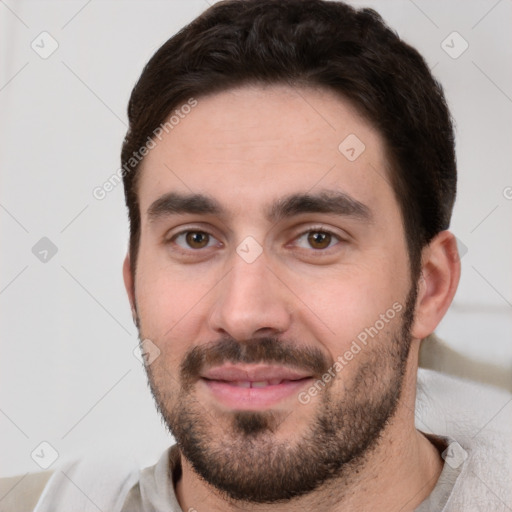 Neutral white young-adult male with short  black hair and brown eyes