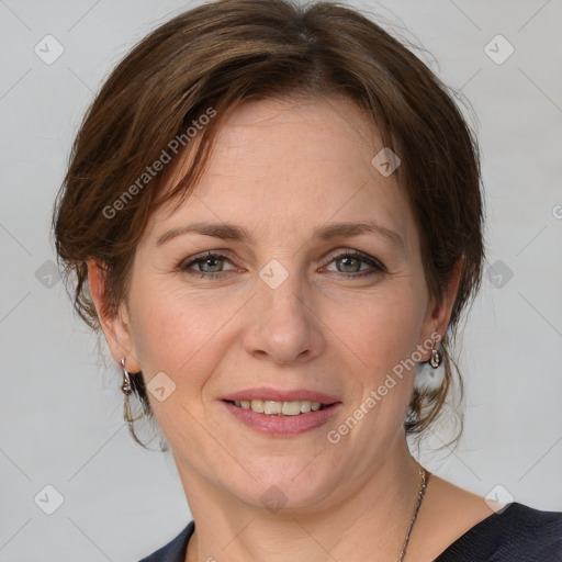 Joyful white adult female with medium  brown hair and blue eyes