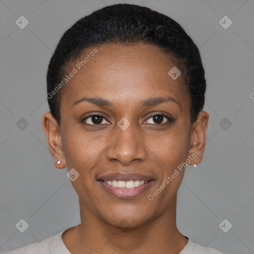 Joyful black young-adult female with short  brown hair and brown eyes