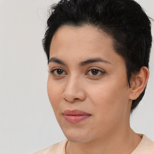 Joyful latino young-adult female with short  brown hair and brown eyes