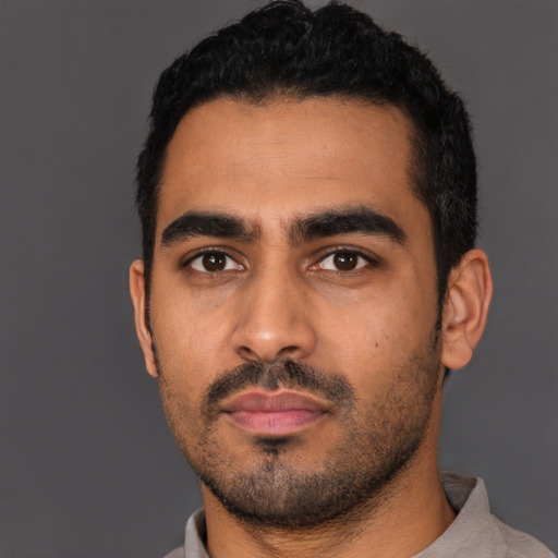 Neutral latino young-adult male with short  black hair and brown eyes