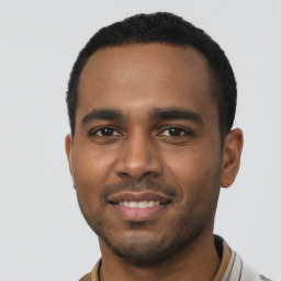 Joyful black young-adult male with short  black hair and brown eyes