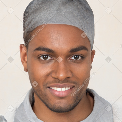 Joyful black young-adult male with short  brown hair and brown eyes