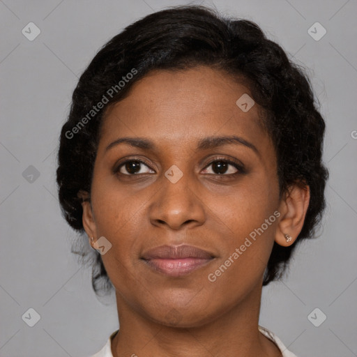 Joyful black adult female with short  brown hair and brown eyes