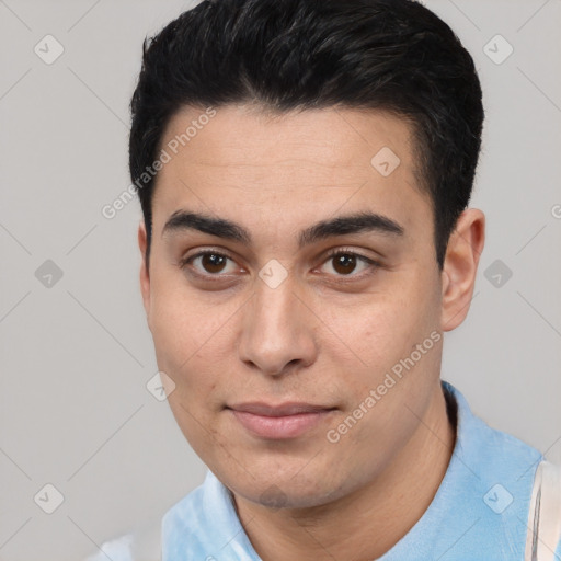 Joyful white young-adult male with short  black hair and brown eyes