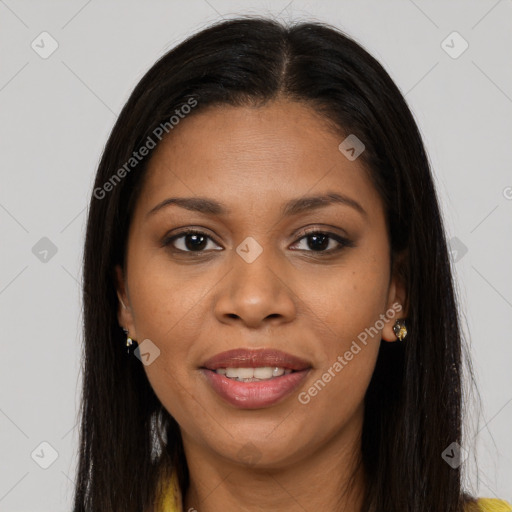 Joyful black young-adult female with long  brown hair and brown eyes