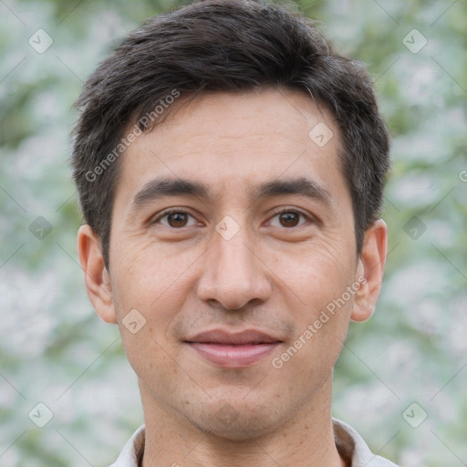 Joyful white adult male with short  brown hair and brown eyes