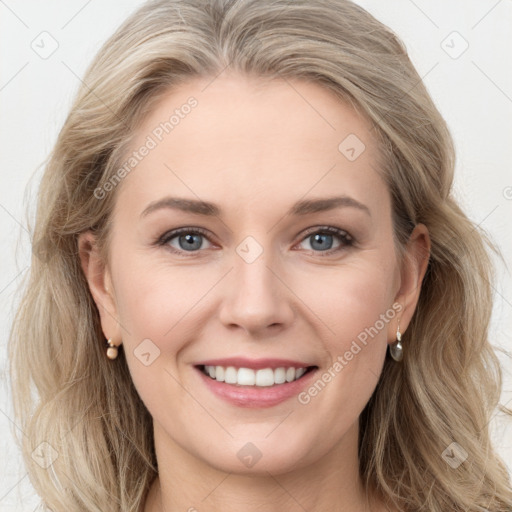 Joyful white young-adult female with long  brown hair and blue eyes