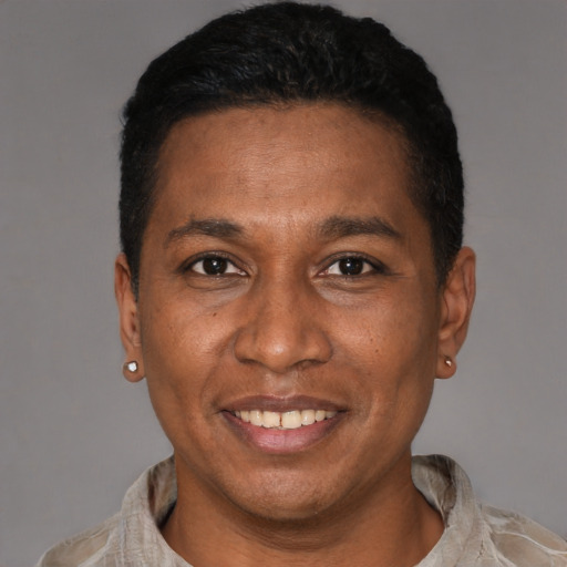 Joyful latino adult male with short  black hair and brown eyes