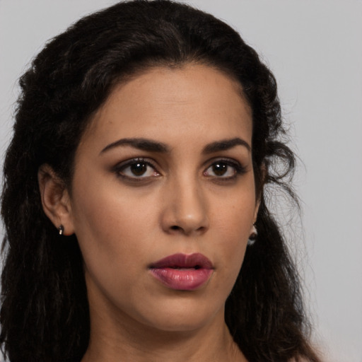 Neutral latino young-adult female with long  black hair and brown eyes