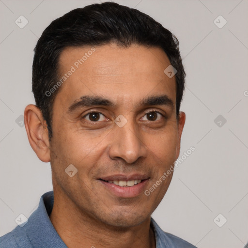 Joyful white adult male with short  black hair and brown eyes