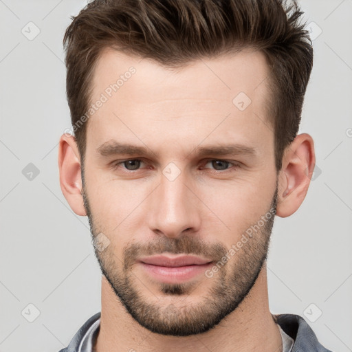 Neutral white young-adult male with short  brown hair and grey eyes