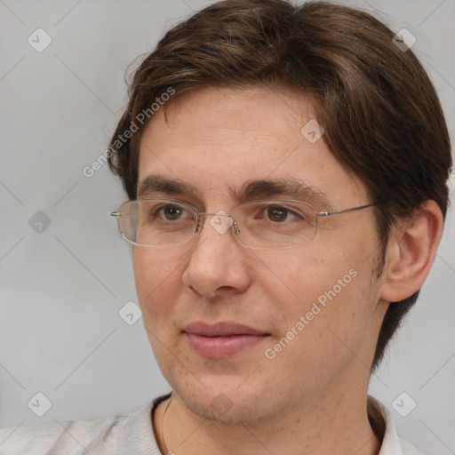 Joyful white adult male with short  brown hair and brown eyes