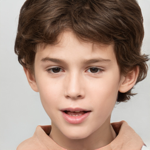 Joyful white child male with short  brown hair and brown eyes