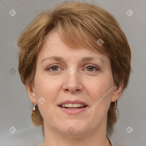 Joyful white adult female with medium  brown hair and blue eyes