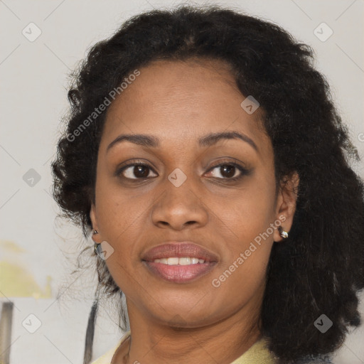 Joyful black adult female with medium  brown hair and brown eyes