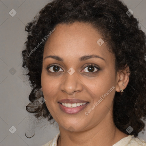 Joyful black young-adult female with medium  brown hair and brown eyes