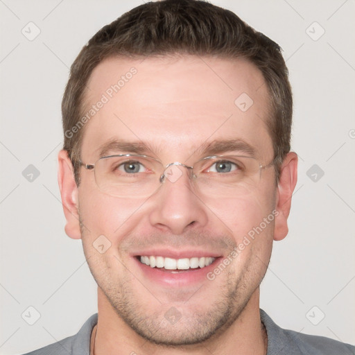 Joyful white adult male with short  brown hair and grey eyes