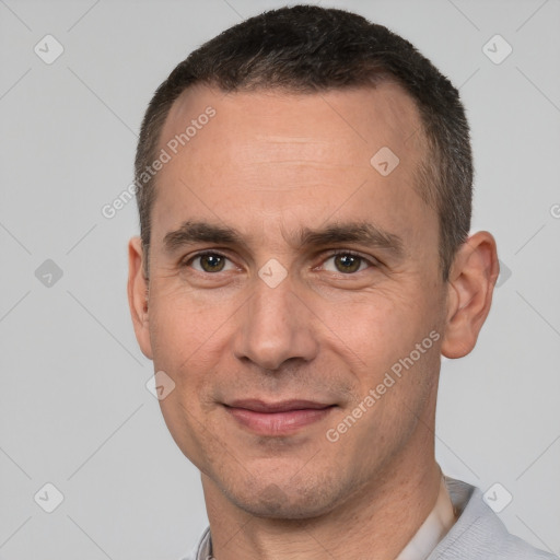 Joyful white adult male with short  brown hair and brown eyes