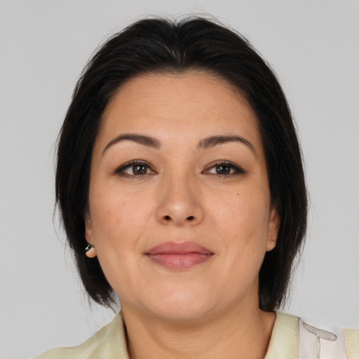 Joyful asian adult female with medium  brown hair and brown eyes