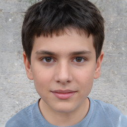 Joyful white child male with short  brown hair and brown eyes