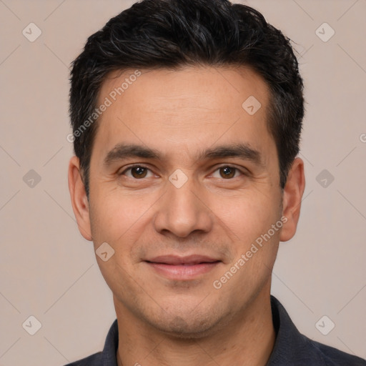 Joyful white young-adult male with short  black hair and brown eyes