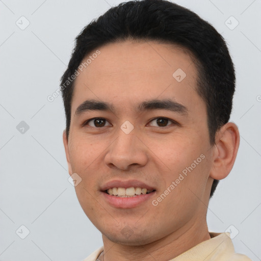 Joyful asian young-adult male with short  black hair and brown eyes