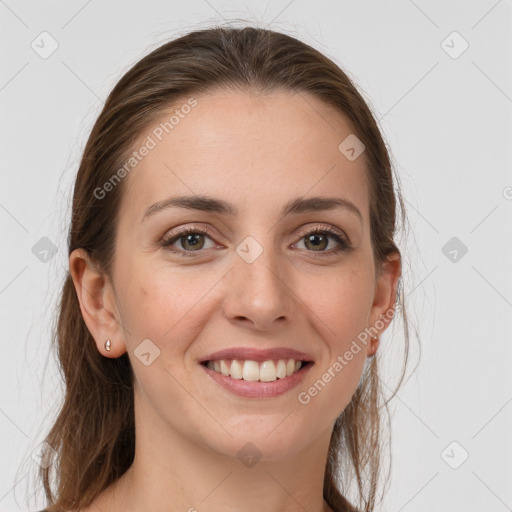 Joyful white young-adult female with long  brown hair and grey eyes