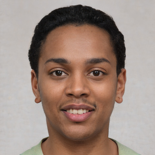 Joyful latino young-adult female with short  black hair and brown eyes