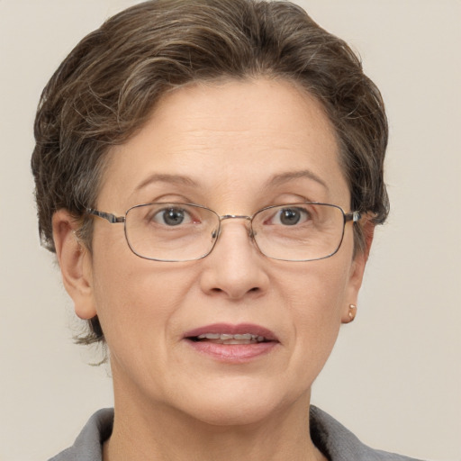 Joyful white middle-aged female with short  brown hair and grey eyes