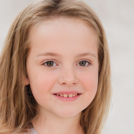 Joyful white child female with long  brown hair and blue eyes