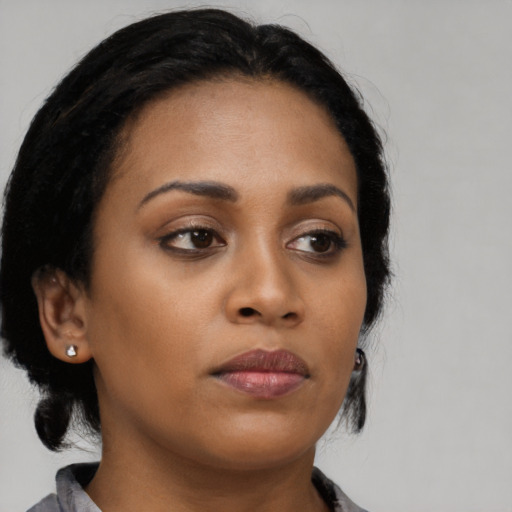 Neutral black young-adult female with medium  black hair and brown eyes