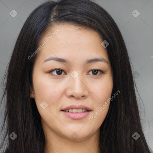 Joyful asian young-adult female with long  brown hair and brown eyes