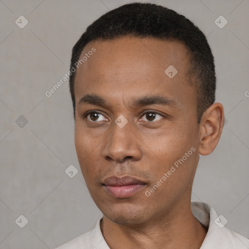 Neutral latino young-adult male with short  black hair and brown eyes