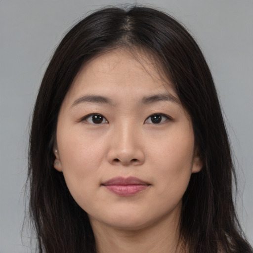 Neutral asian young-adult female with long  brown hair and brown eyes