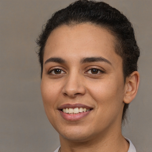 Joyful white young-adult female with short  brown hair and brown eyes