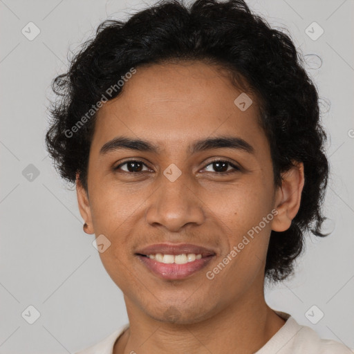 Joyful latino young-adult male with short  brown hair and brown eyes