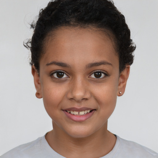 Joyful white child female with short  brown hair and brown eyes