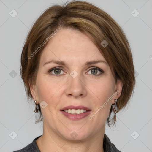 Joyful white adult female with medium  brown hair and grey eyes