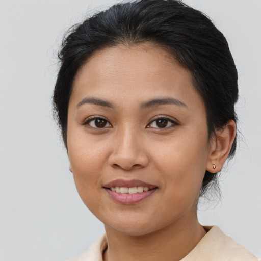 Joyful asian young-adult female with medium  brown hair and brown eyes