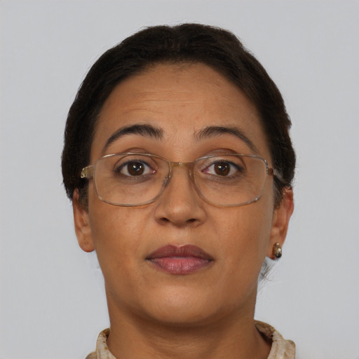 Joyful black adult female with short  brown hair and brown eyes