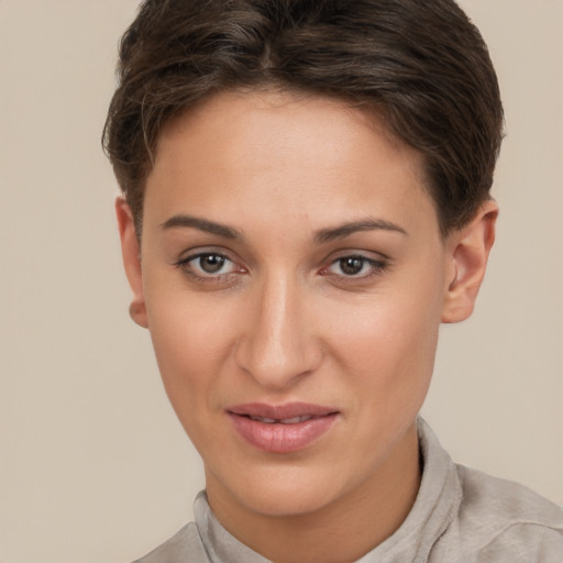 Joyful white young-adult female with short  brown hair and brown eyes