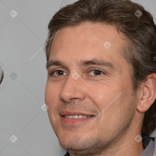 Joyful white adult male with short  brown hair and brown eyes