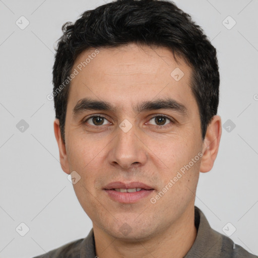 Joyful white young-adult male with short  black hair and brown eyes